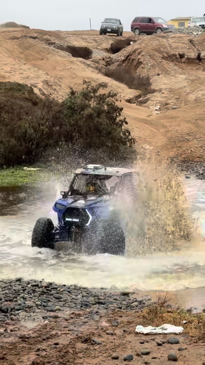 High Altitude Racing car 355 emerging from a flooded NORRA 500 course