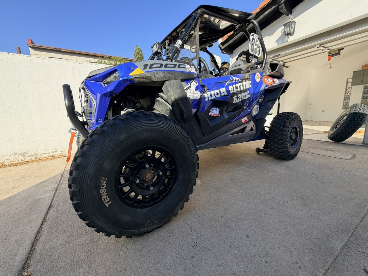 NORRA race tire beside the small OEM transport tire