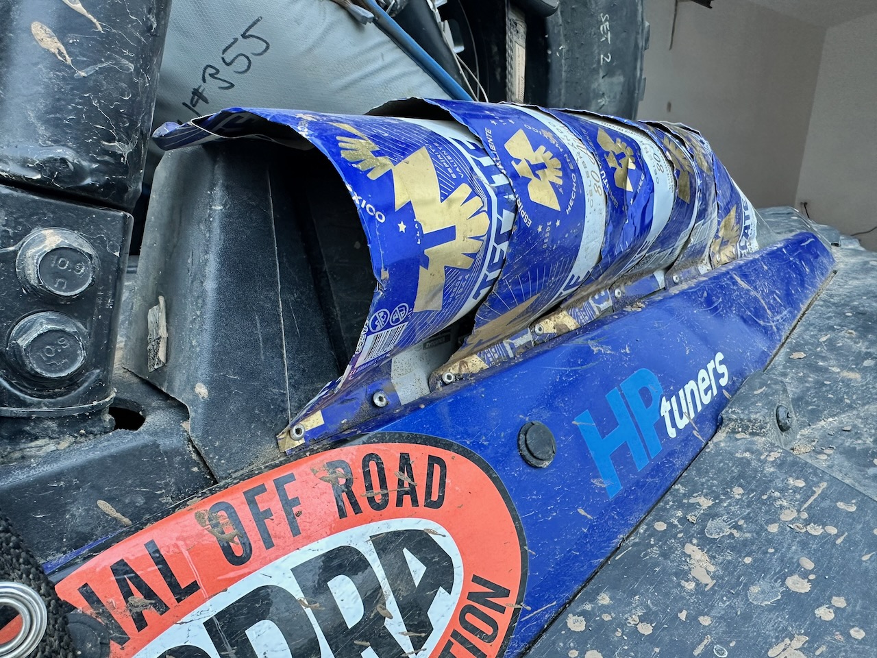 Tecate beer-can air scoop riveted to the CVT intake on race car 355