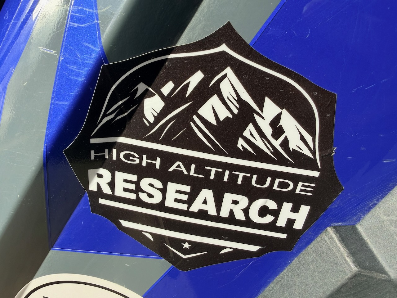 High Altitude Research sponsor sticker on race car 355
