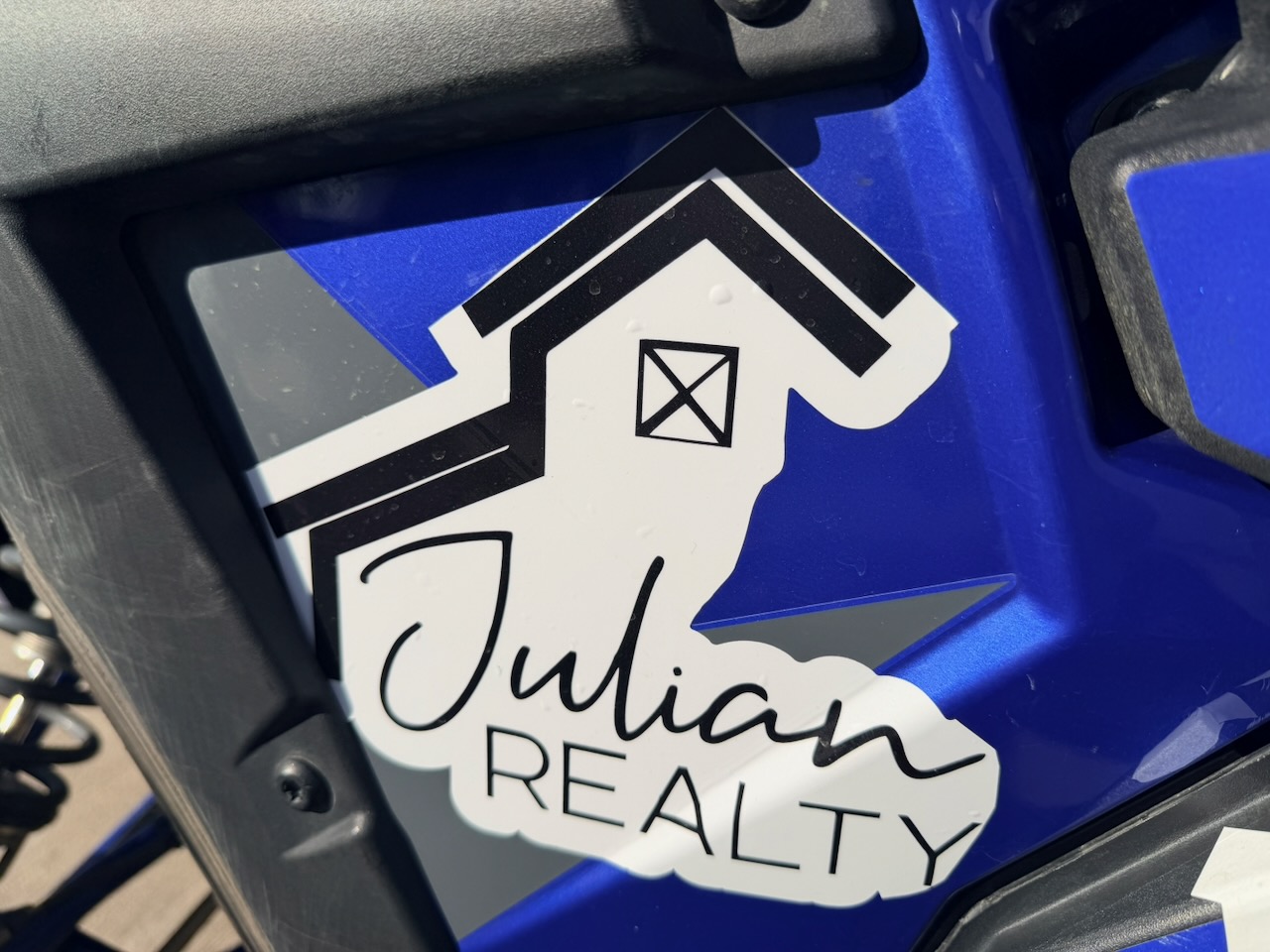 Julian Realty sponsor sticker on race car 355